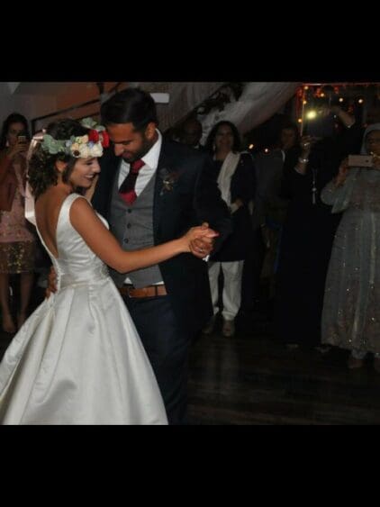 A gorgeous image of the back of Natasha’s Alma Novia Ivory gown.