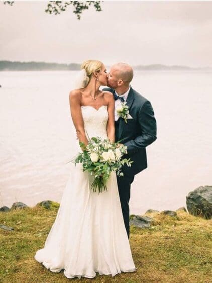 How beautiful does Jenni look in her stunning gown for her July 2017 wedding. We helped create this stunning gown at BOA Boutique. The dress is from Ivory & Co featuring a silk chiffon skirt and a hand beaded lace bodice.The backdrop helps to make this picture look so dreamy!