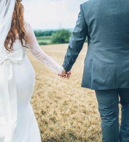 Our BOA Real Bride Ruth looks absolutely incredible in her ivory silk and lace gown with sleeves for her 2016 wedding. With her incredible bow detail this gown looks just as beautiful from the back as is does from the front.